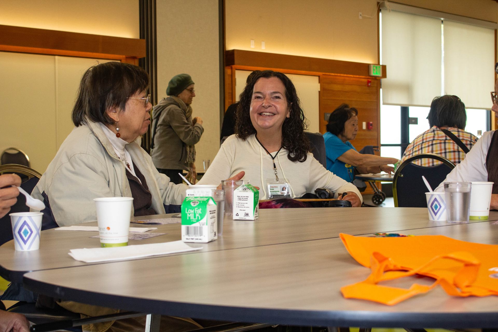 Case Manager, Rose, consults with a client at an Easy Does It event.