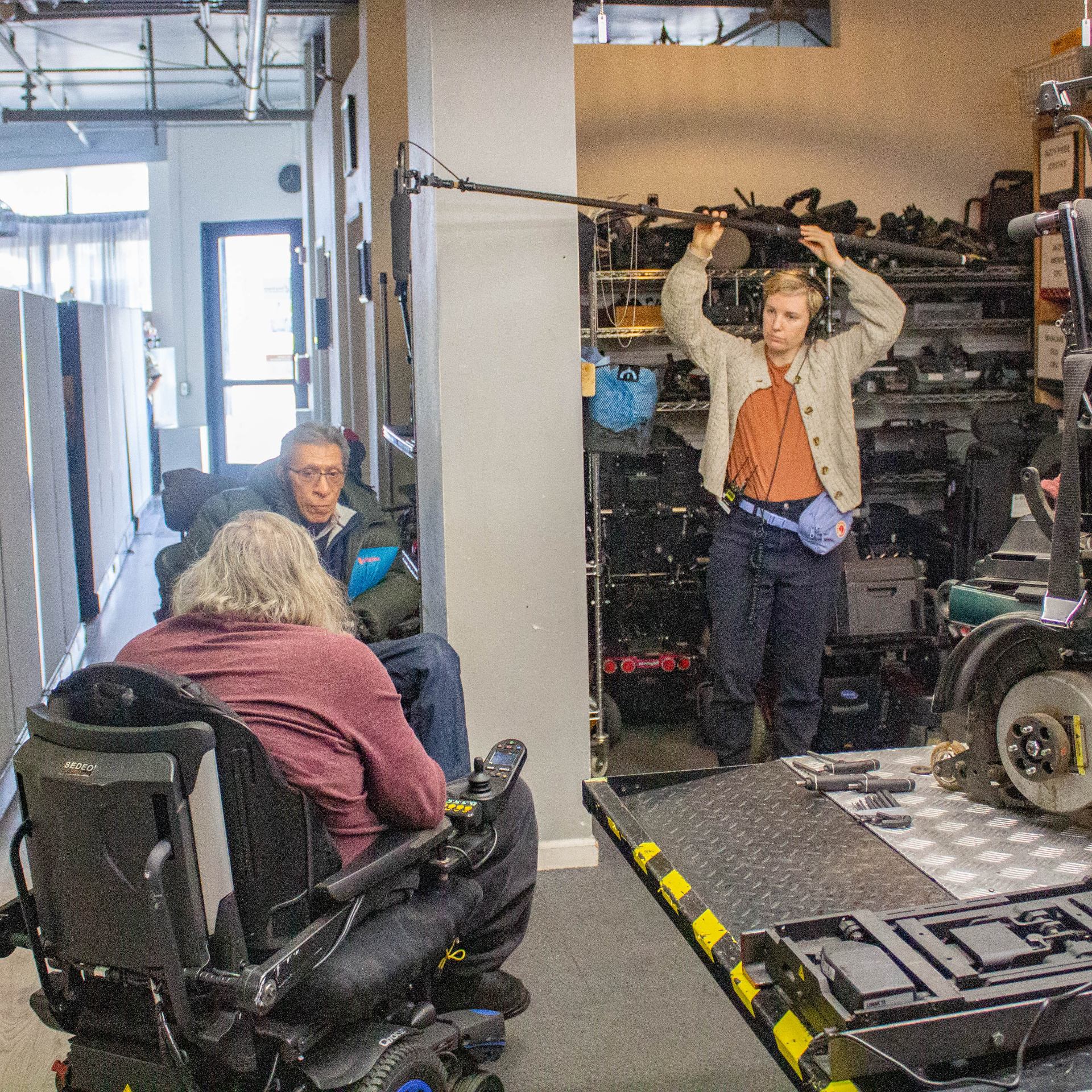 A film crew records a coversation between Bruce (Executive Director) and Felix (Board Member.)