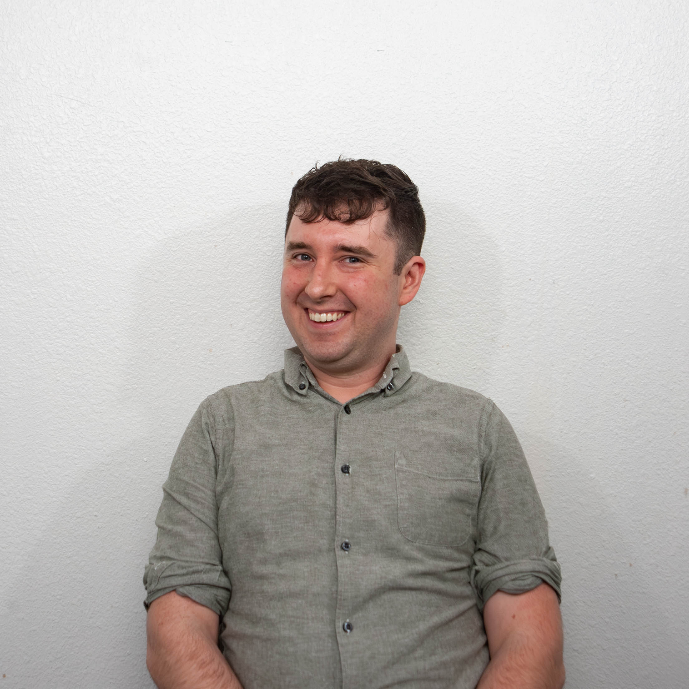Portrait of Trevor Jacobson, Communications Coordinator